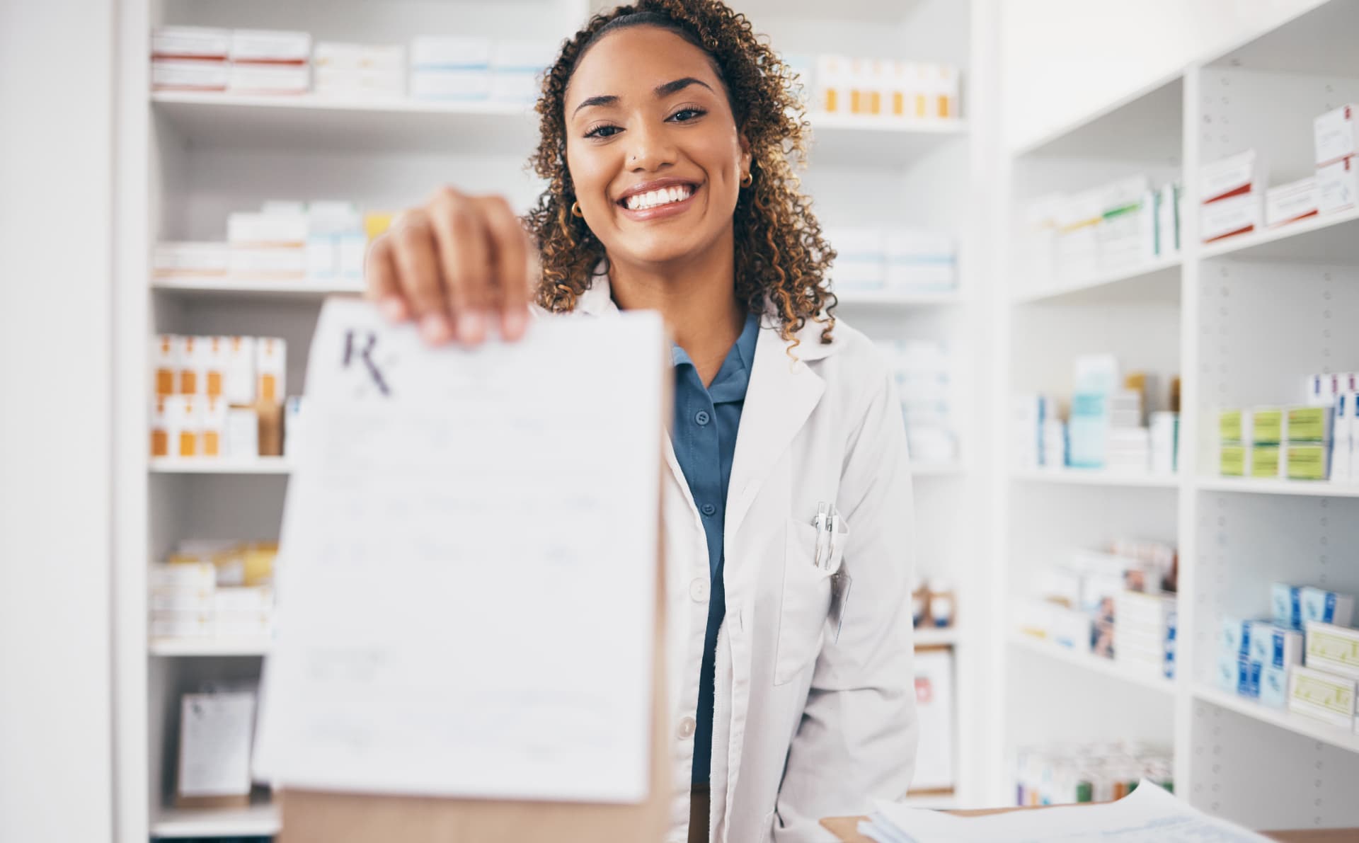 Pharmacist handing over a prescription